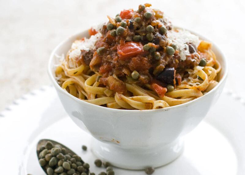 In this July 18, 2011 photo taken in Concord, N.H., capers are featured as a classic ingredient in puttanesca pasta sauce.