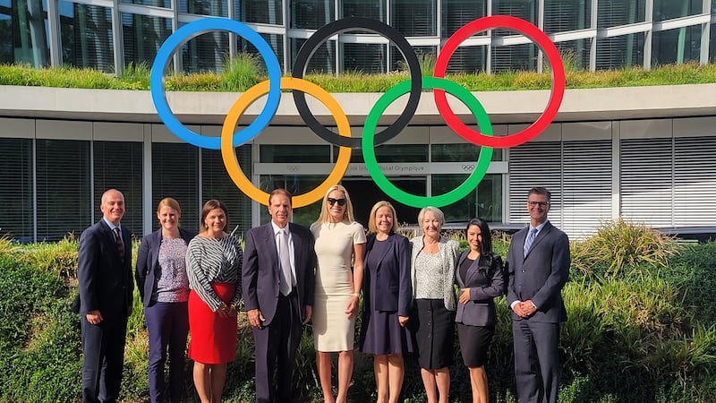 Members of the Salt Lake City-Utah Committee for the Games pose for a photo at the IOC’s headquarters in Switzerland.