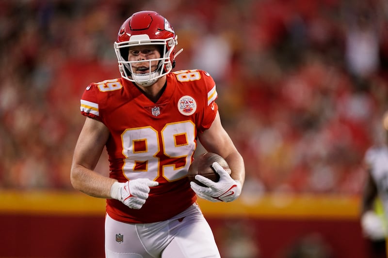 Kansas City Chiefs tight end Matt Bushman scores on a touchdown run during the first half of an NFL preseason football game against the Green Bay Packers Thursday, Aug. 25, 2022, in Kansas City, Mo.