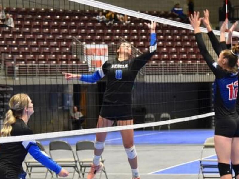 Rich’s Darleen Petersen hits the ball