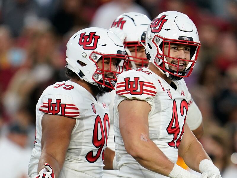 Utah defensive end Mika Tafua (42) reacts after sacking USC quarterback Kedon Slovis during game Saturday, Oct. 9, 2021, in Los Angeles.