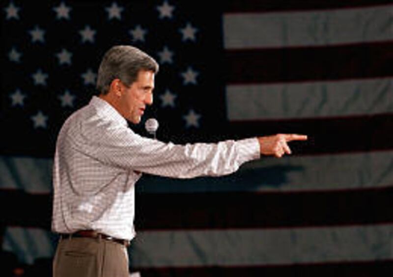 Sen. John Kerry speaks Monday at a rally at Ohio State University. John Edwards drew a slim crowd at a University of Toledo rally.