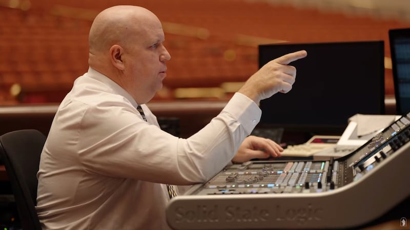 Aaron Kobel, an audio engineer for the Church, tests microphone audio sound before general conference.