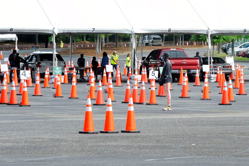 People work at a mass vaccination site operated by the University of Alabama.
