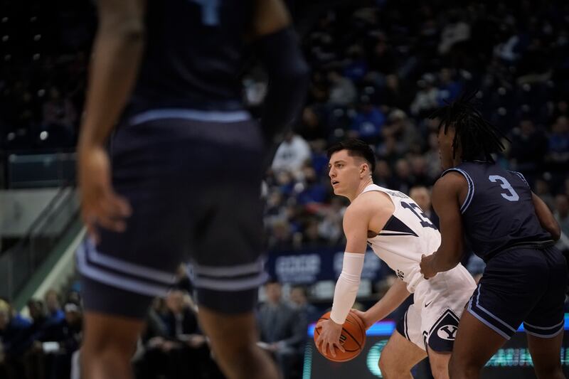 BYU guard Alex Barcello looks to passs as BYU and San Diego play in Provo at the Marriott Center on Thursday, Jan. 20, 2022.