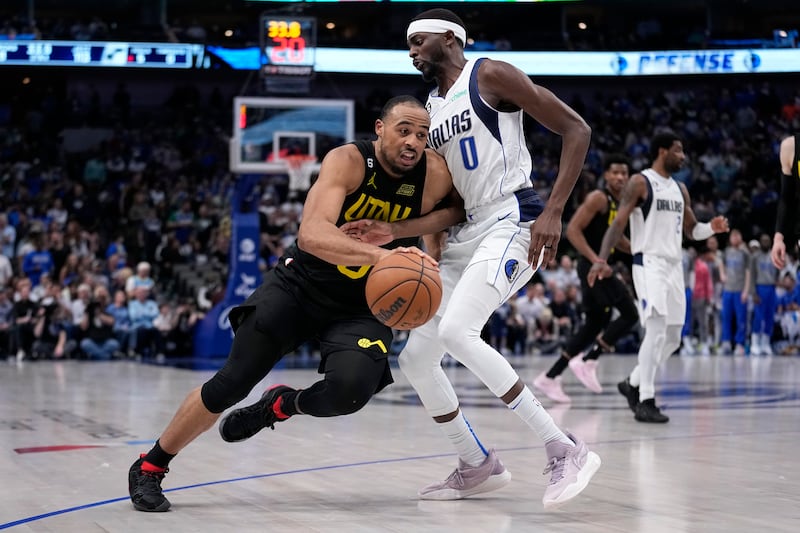 Utah Jazz guard Talen Horton-Tucker dribbles