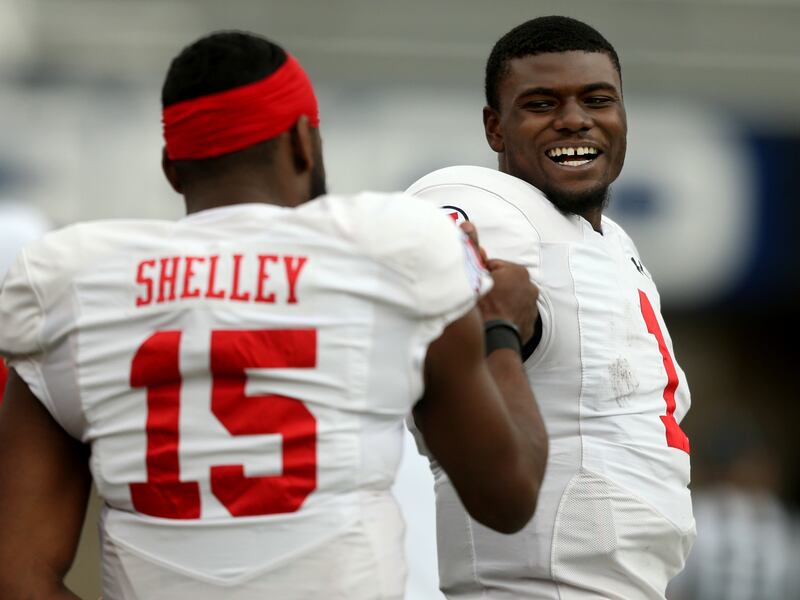 Utah QBs Jason Shelley and Tyler Huntley laugh during a scrimmage at Rice-Eccles Stadium in Salt Lake City on Friday, April 5, 2019.