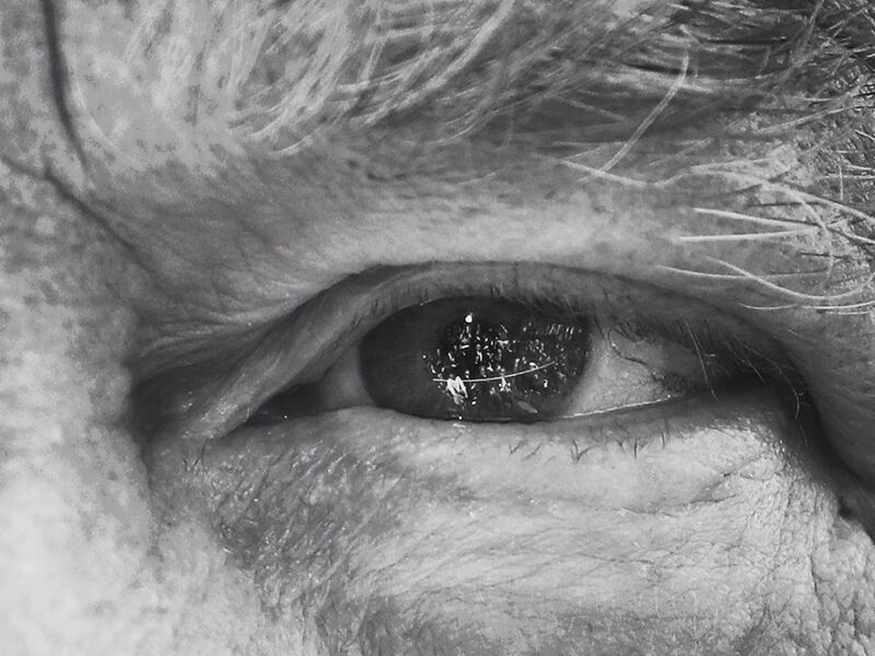 The media are seen reflected in eye of President Trump as he answers questions on the South Lawn of the White House in Washington, before boarding Marine One helicopter.