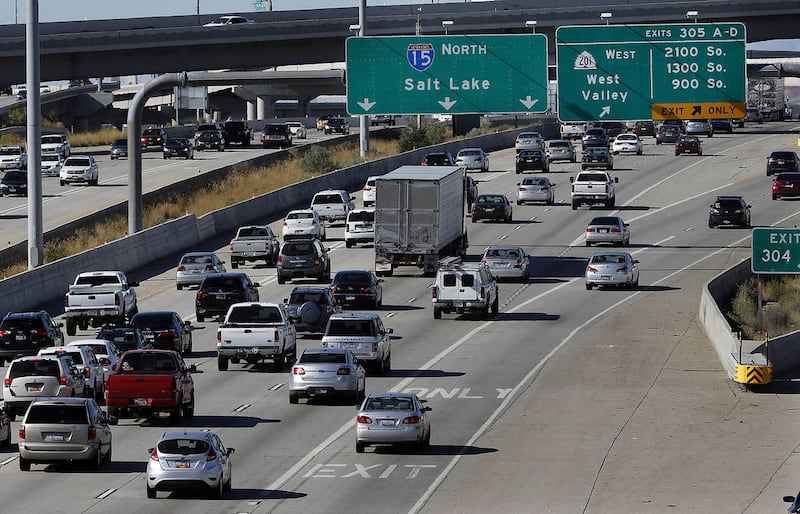 Traffic moves on I-15 in Salt Lake County during rush hour, Thursday, Aug. 28, 2014