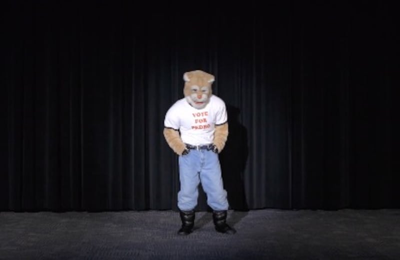 In a new video, BYU’s Cosmo the Cougar take his mask off after dancing like Napoleon Dynamite.