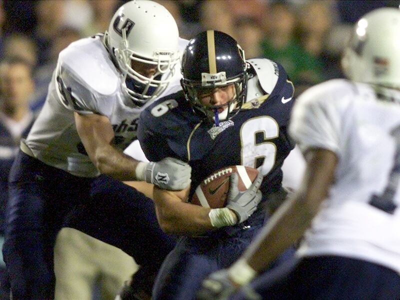 BYU’s Luke Staley runs into congestion against the Utah State defense on Oct. 5, 2001.