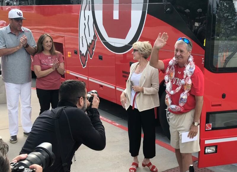 Retiring Ute athletic director Chris Hill waves before getting on a bus during his sendoff celebration Friday.