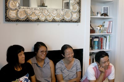Chau Phung's children, Sally Tieu, left, Amy Tieu, Yen Tieu and Kim Tieu listen as their mother and Dave Hansen are reunited after 40 years at Phung's home in Riverton on Friday, July 12, 2019. Hansen and his wife, Carol, were the host family for Phung, h