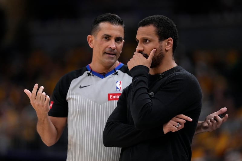 Boston Celtics head coach Joe Mazzulla talks with referee Zach Zarba, left, during Game 4 of the NBA Eastern Conference basketball finals against the Indiana Pacers, Monday, May 27, 2024, in Indianapolis.