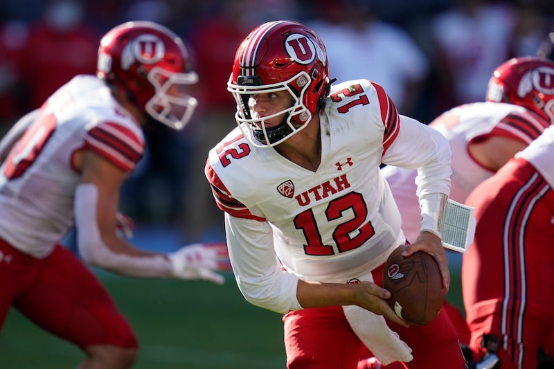 Utah quarterback Charlie Brewer (12) looks to hand off the ball against San Diego State.