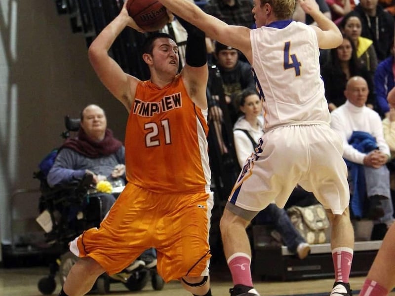 FILE -- Timpview's Roy Taylor looks to pass in a basketball game on Friday, Feb. 8, 2013. Former BYU guard Kevin Santiago was recently hired as the basketball coach at Timpview High School.