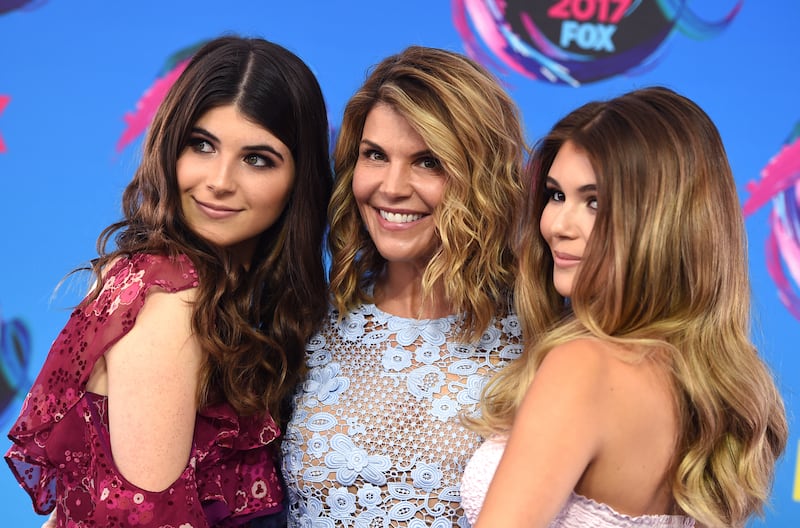 Bella Giannulli, from left. Lori Loughlin, and Olivia Giannulli arrive at the Teen Choice Awards at the Galen Center on Sunday, Aug. 13, 2017, in Los Angeles.