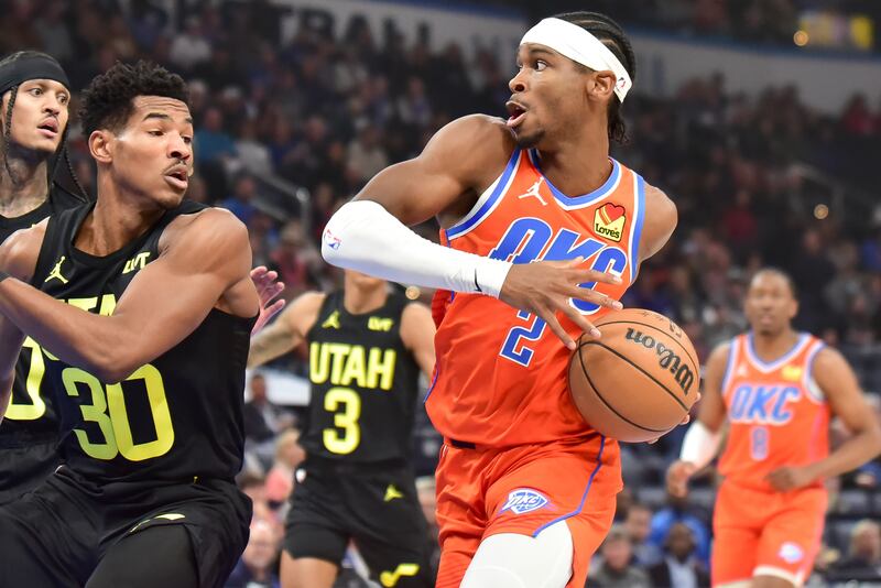 Oklahoma City Thunder guard Shai Gilgeous-Alexander (2) drives past Utah Jazz guard Ochai Agbaji (30)