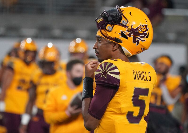 Arizona State quarterback Jayden Daniels looks on before a game with Colorado Sat, Sept 25, 2021, in Tempe, Ariz.