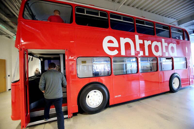 Coby Rich, vice president of marketing at Entrata, show off a double-decker bus inside the company’s offices in Lehi on Feb. 25, 2020.