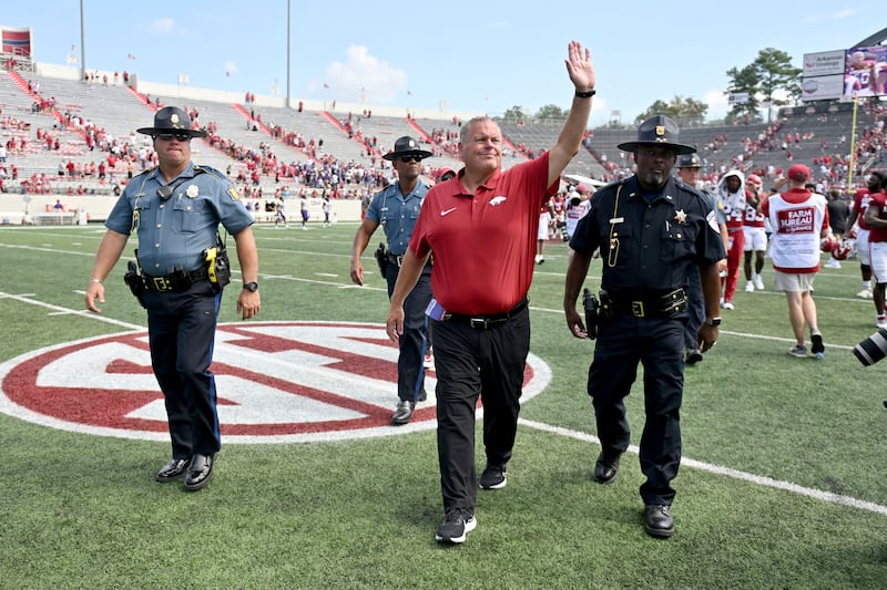 Arkansas coach Sam Pittman waves to fans on his way to the locker room after the Razorbacks game against Western Carolina.