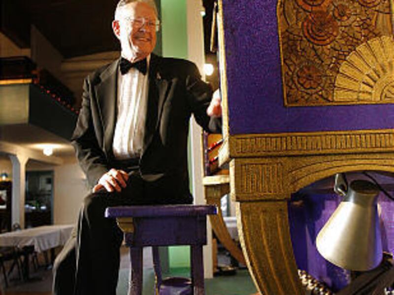 Blaine Gale sits at the Mighty Wurlitzer at the Organ Loft in Salt Lake City in 2007.