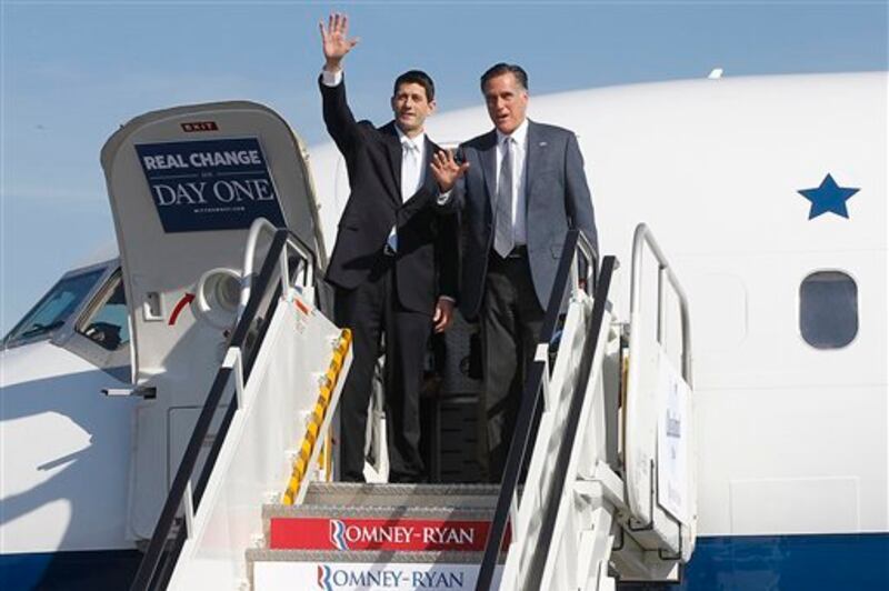 Republican presidential candidate, former Massachusetts Gov. Mitt Romney and his running mate Rep. Paul Ryan, R-Wis., wave as they exit a campaign charter airplane at Cleveland Hopkins International airport, Tuesday, Nov. 6, 2012 in Cleveland, Ohio. Ryan