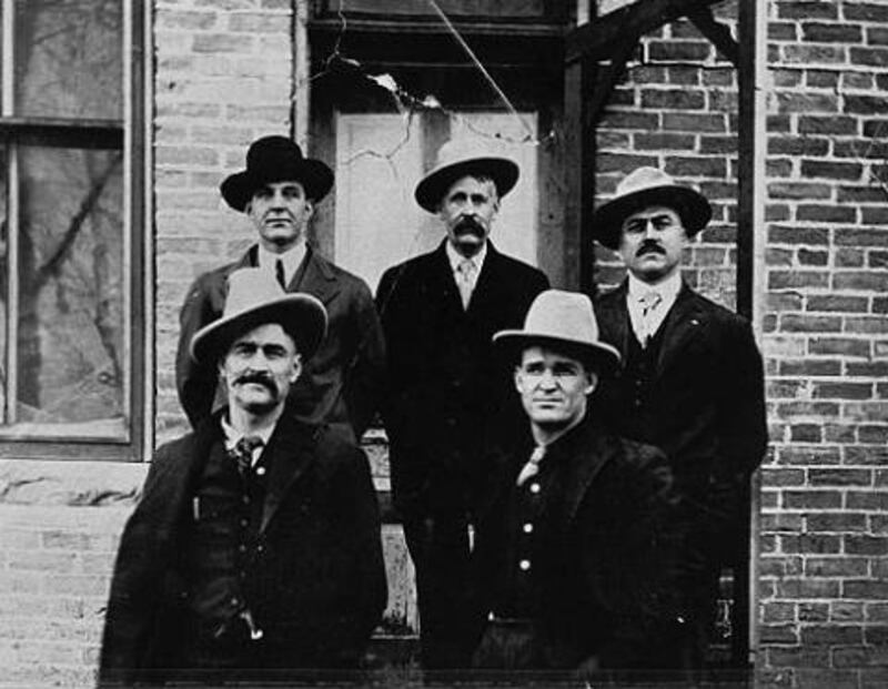 Photograph of the defendants in the Spring Creek Raid case in custody at Basin, Wyoming. Clockwise from top left: Herb Brink, Ed Eaton, George Saban, Tom Dixon, Milton Alexander