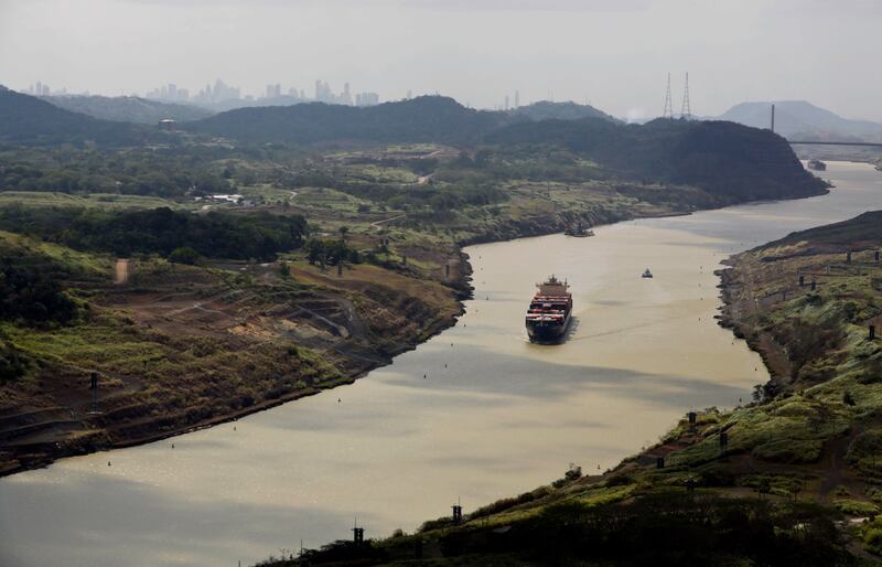 This March 23, 2015 file photo shows a cargo ship sailing through the Culebra Cut, during a media tour organized by Salini Impregilo, sub-contractor of the canal expansion project in Panama City, Panama. In 1903, the U.S. engineered Panamanian independenc