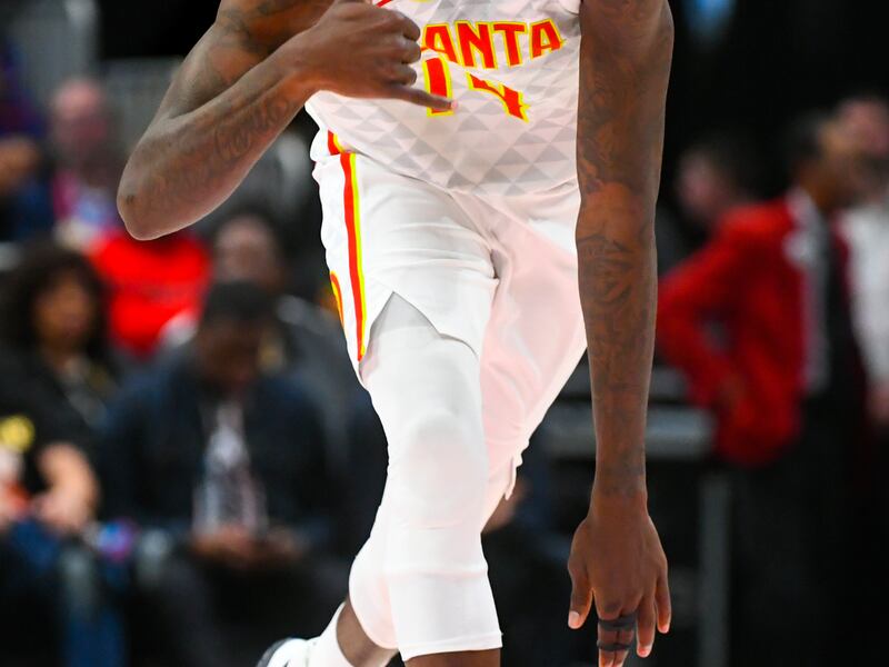 Atlanta Hawks center Dewayne Dedmon reacts as he comes up the floor after scoring during the first half of an NBA basketball game against the Utah Jazz, Thursday, March 21, 2019, in Atlanta. (AP Photo/John Amis)