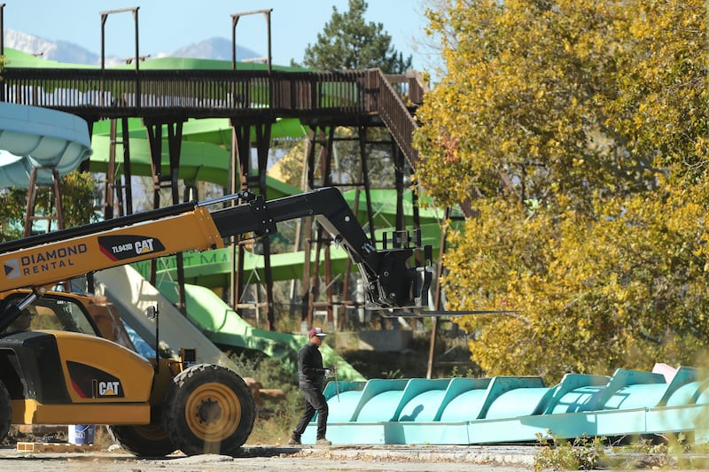 Workers tear down the old Raging Waters/Seven Peaks water park in Salt Lake City on Friday, Oct. 15, 2021.
