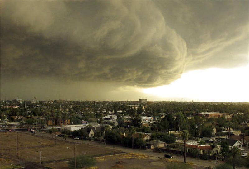 Storm clouds move across downtown Phoenix Tuesday afternoon. A series of powerful thunderstorms hit the area with high winds, hail bigger than golf balls and heavy rain.