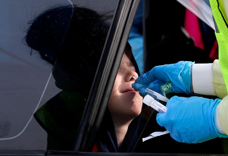 A child is tested for COVID-19 in Bountiful, Utah.