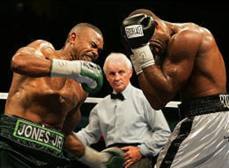 Roy Jones Jr., left, throws a punch against Prince Badi Ajamu in Saturday night's NABO light heavyweight title fight in Boise.