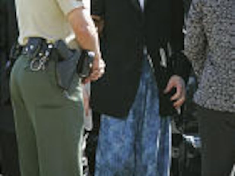Michael Jackson arrives at court in Santa Maria after leaving hospital. He barely avoided being arrested for being late.<BR>