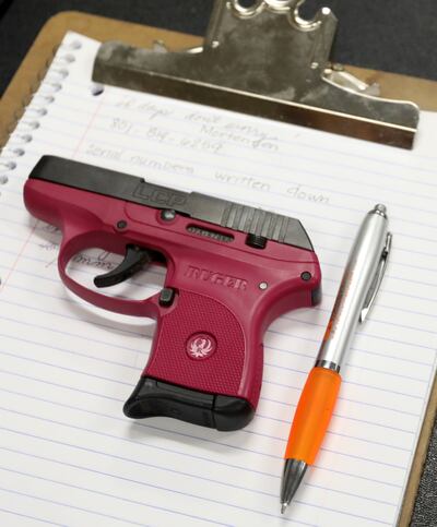 Jennifer Jacobsen's notebook, pen and pistol lay on a desk during class at the Utah County Sheriff's Office in Spanish Fork on Wednesday, June 12, 2019. Jacobsen teaches physical education at Willow Creek Middle School in Lehi.