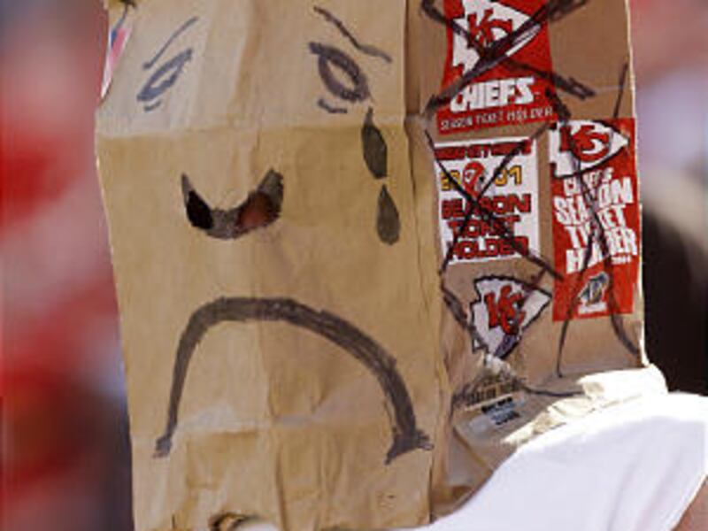 A disgruntled Kansas City fan wears a paper bag over his head during the Chiefs' loss to the Titans.