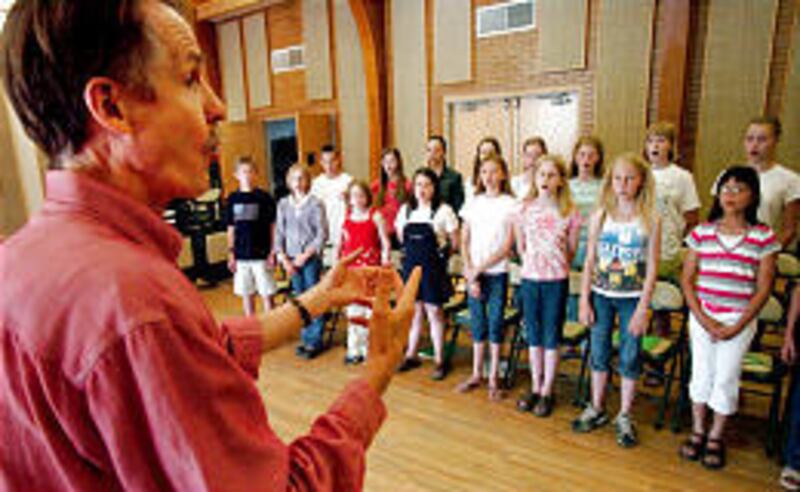 Ralph Woodward leads the Salt Lake Children's Choir in rehearsal last year. The group turns 25 this year.