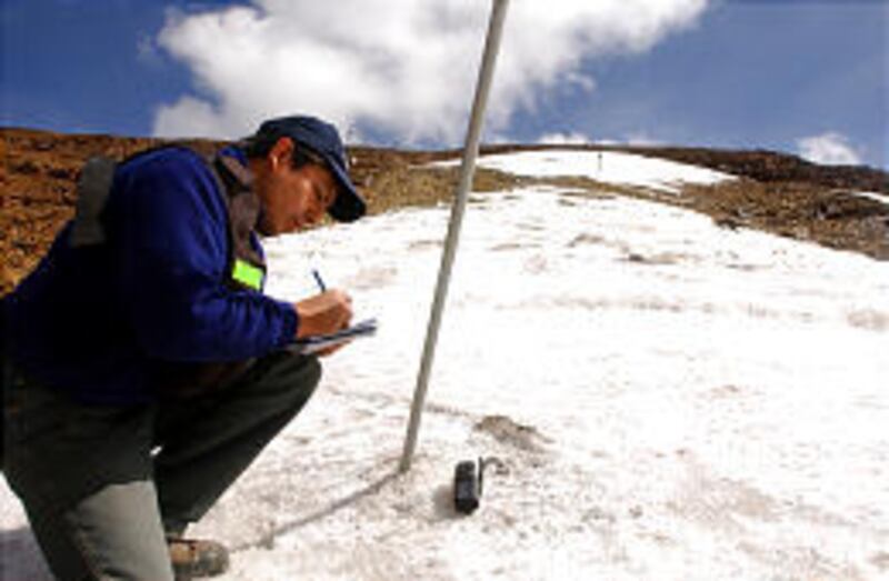 Glaciologist Edson Ramirez measures tropical glacier Chacaltaya, near La Paz. He says that Chacaltaya, long a frozen storehouse of water, will be gone in seven to eight years.