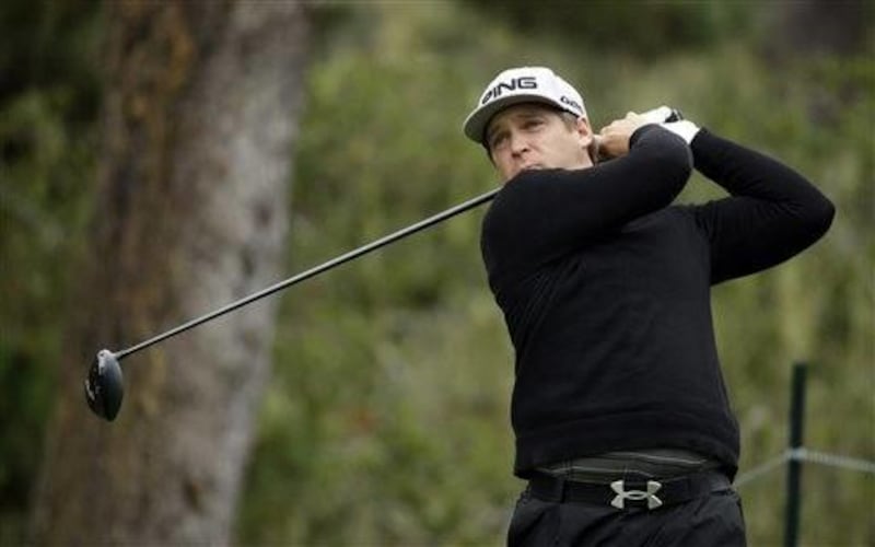 Daniel Summerhays follows through with his shot on the 17th hole Saturday, Feb. 8, 2014, during the third round of the AT&T Pebble Beach Pro-Am golf tournament on the Spyglass Hill Golf Course in Pebble Beach, Calif. (AP Photo/Ben Margot)