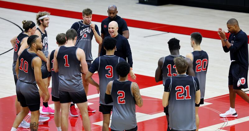 Utah’s coach Craig Smith talks to his players as the Utes open camp in Salt Lake City on Sept. 26, 2022.