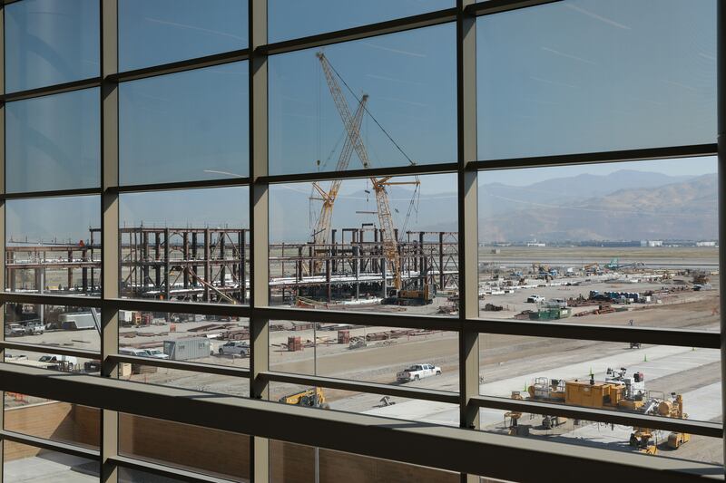 Construction on Phase 2 of the Salt Lake City International Airport is pictured through the windows of the completed portion of the facility on Wednesday, which marked the first anniversary of the opening of Phase 1 of the airport.