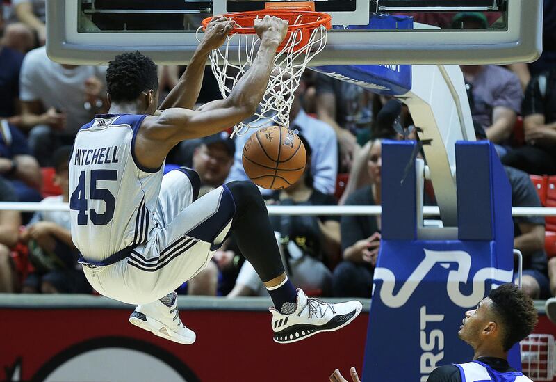 Utah Jazz guard Donovan Mitchell (45) goes high for a dunk as the Utah Jazz and the Philadelphia 76ers play in Summer league action in the Huntsman Center at the University of Utah in Salt Lake City on Wednesday, July 5, 2017.