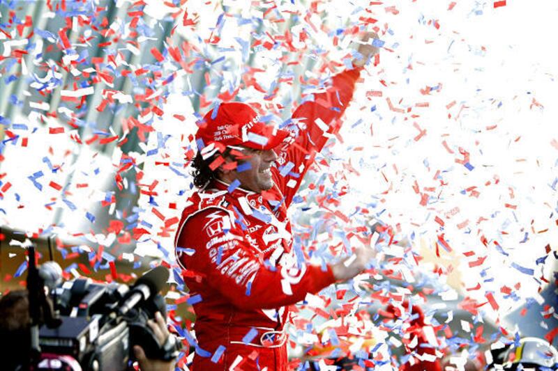 IRL driver Dario Franchitti celebrates after winning the Firestone Indy 300 auto race in Homestead, Fla., Saturday.