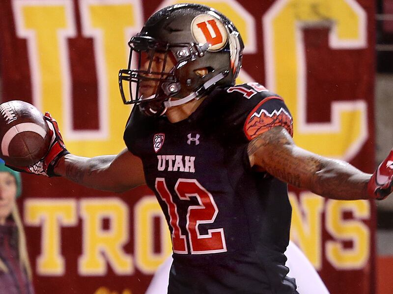 Utah Utes wide receiver Tim Patrick stands with his arms outstretched