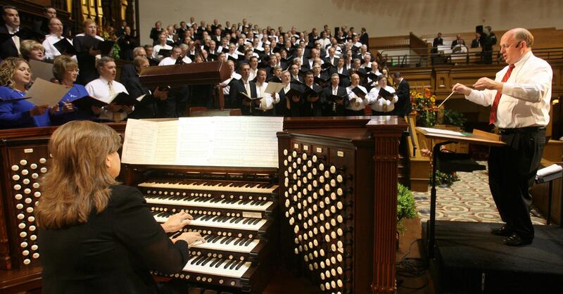 FILE - Linda Margetts, left, plays the organ as Mack Wilberg conducts a rehearsal in the newly-refurbished Tabernacle during preparations for a Music and the Spoken Word performance by the Mormon Tabernacle Choir Sunday, September 23, 2007. Photo by Jaso