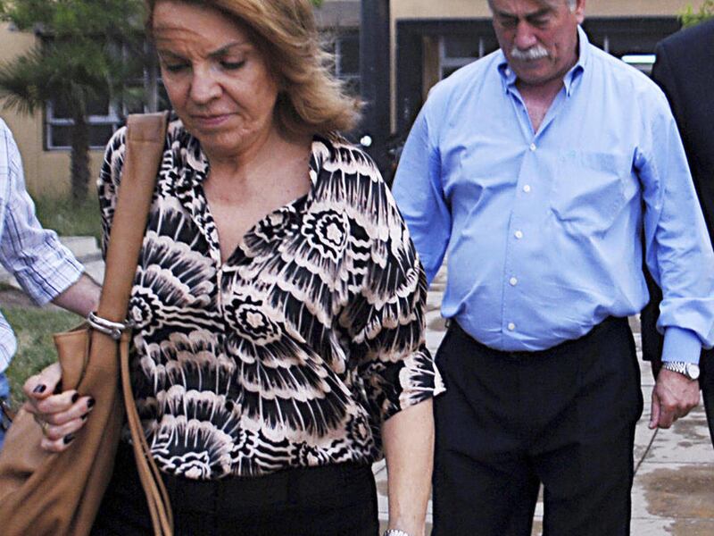 In this photo taken Nov. 17, 2011, Susana Soria is followed by her husband Carlos Soria, governor of the southern Argentine province of Rio Negro, in General Roca, Argentina. Soria, 62, who had just taken office on Dec. 9, was shot to death Sunday, Jan. 1