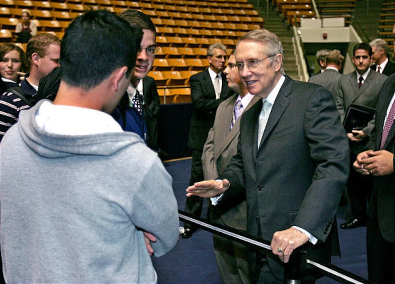 Senate Majority Leader Harry Reid, D-Nevada, talks with BYU student Andres Parada on Tuesday after his address to 4,091 people at a BYU forum.