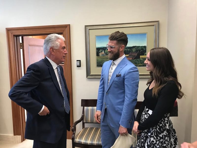 Elder Dieter F. Uchtdorf meets with Bryce Harper and Kayla Varner Harper in October, 2018.