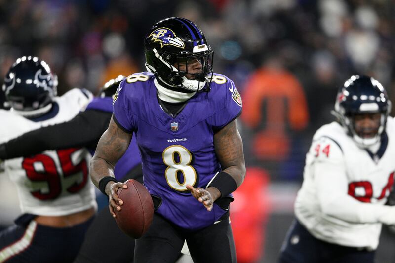 Baltimore Ravens quarterback Lamar Jackson (8) plays during the first half of an AFC divisional playoff NFL football game.